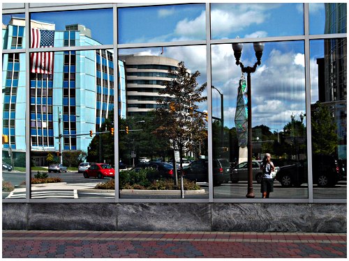 building next door reflection across the street - L1/new lens