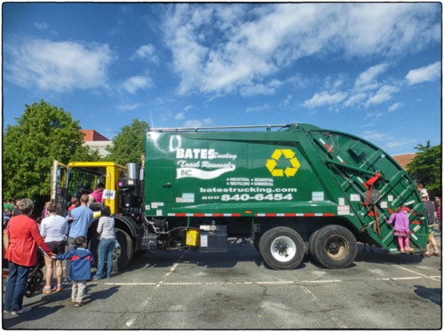 Only in Arlington do people queue up to see a garbage truck.