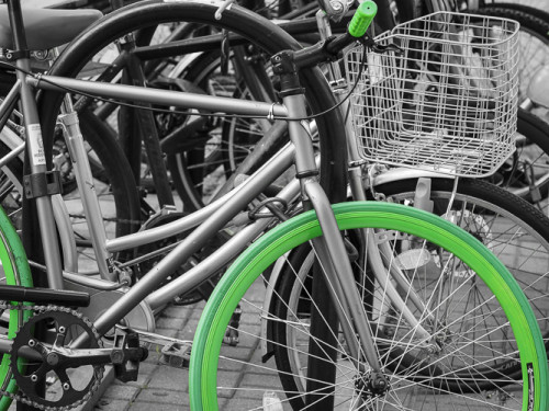 bikes parked at my metro stop. love the green wheels.