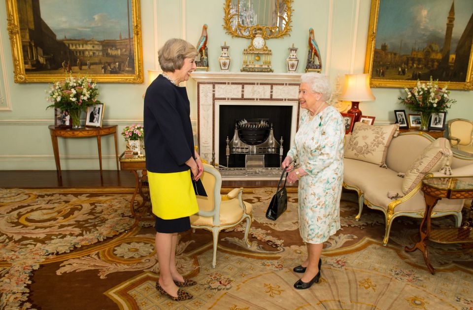 Queen Elizabeth II welcomes Theresa May at the start of an audience in Buckingham Palace, London, where she invited the former Home Secretary to become Prime Minister and form a new government. PRESS ASSOCIATION Photo. Picture date: Wednesday July 13, 2016. See PA story POLITICS Conservatives. Photo credit should read: Dominic Lipinski/PA Wire