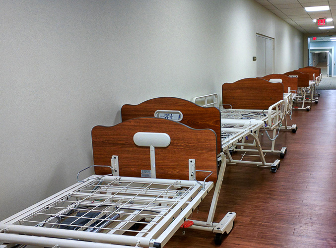 What the inmates actually see - an endless string of tasteful hospital beds heading to "EXIT".