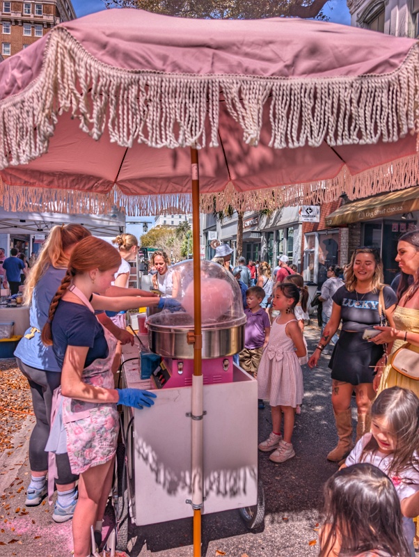 When lunch was over. I wentout and discovered the street was closed and vendors were selling everything. Beer, cocktails, cotton candy. . .